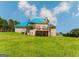 View of the rear exterior of the large two-story house with a large grassy area at 145 Windy Ridge Ct, Fayetteville, GA 30214