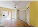 Bright, yellow kitchen and breakfast nook area with view into the living room; needs updating at 145 Windy Ridge Ct, Fayetteville, GA 30214