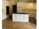 Kitchen with island, plenty of cabinet space, and older appliances at 145 Windy Ridge Ct, Fayetteville, GA 30214