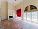Open living room with tall ceilings and a fire place is ready to be renovated at 145 Windy Ridge Ct, Fayetteville, GA 30214