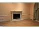 Living room highlighting fireplace, mantle, and hardwood floors at 145 Windy Ridge Ct, Fayetteville, GA 30214