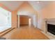 Open living room with tall ceilings and a fireplace is ready to be renovated at 145 Windy Ridge Ct, Fayetteville, GA 30214