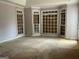 Main bedroom featuring large windows, trim, and spacious design at 145 Windy Ridge Ct, Fayetteville, GA 30214