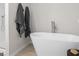 Contemporary bathroom featuring a freestanding tub and sleek, modern fixtures at 11555 Kimberly Way, Hampton, GA 30228