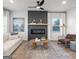 Stylish living room featuring a modern fireplace, wood accents, and a comfortable seating area at 11555 Kimberly Way, Hampton, GA 30228