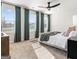 Serene main bedroom with large windows, neutral tones, and a plush king-sized bed at 11555 Kimberly Way, Hampton, GA 30228