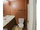 Bathroom with a mirror, toilet, sink, and a bathtub behind a white door at 4014 Oak Stone Dr, Douglasville, GA 30135