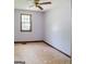 Bedroom with lavender walls, a ceiling fan, and a window with backyard views at 4014 Oak Stone Dr, Douglasville, GA 30135