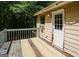 Exterior deck featuring weathered wood, railing, and access door at 4014 Oak Stone Dr, Douglasville, GA 30135