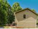 Side view of house and the lush greenery surrounding it showcases its serene location at 4014 Oak Stone Dr, Douglasville, GA 30135