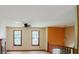 Second floor landing featuring two large windows, a fireplace, and a ceiling fan at 4014 Oak Stone Dr, Douglasville, GA 30135
