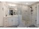 Bright bathroom with a glass shower, white vanity, and modern fixtures at 1848 Eastmore Ave, Conyers, GA 30094