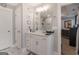 Elegant bathroom featuring a white vanity, modern lighting, and stylish accessories at 1848 Eastmore Ave, Conyers, GA 30094