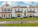 Inviting townhome showcases a well-manicured lawn and garden, enhancing its curb appeal at 1848 Eastmore Ave, Conyers, GA 30094