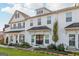 This townhome features black roof accents that beautifully complement the white siding at 1848 Eastmore Ave, Conyers, GA 30094