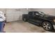 Spacious two-car garage with a black RAM 1500 parked inside at 1848 Eastmore Ave, Conyers, GA 30094