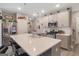 Gourmet kitchen with quartz countertops, stainless appliances, and a large island with seating at 1848 Eastmore Ave, Conyers, GA 30094