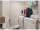 Bright laundry room featuring a modern LG washer and dryer, plus wire shelving for organized storage at 1848 Eastmore Ave, Conyers, GA 30094