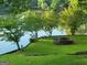 Lawn area with fire pit, and lake view at 45 Surrey Chase Dr, Social Circle, GA 30025