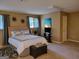 Cozy bedroom featuring a comfortable bed, ample natural light, and neutral color scheme at 45 Surrey Chase Dr, Social Circle, GA 30025