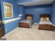 Cozy bedroom with two twin beds, carpeted floors, and a charming, peaceful ambiance at 45 Surrey Chase Dr, Social Circle, GA 30025