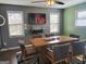 Cozy dining room with a modern table, seating for six, and TV with neutral wall color at 45 Surrey Chase Dr, Social Circle, GA 30025