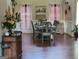 Cozy dining area bathed in soft natural light, featuring a farmhouse-style table and chairs at 45 Surrey Chase Dr, Social Circle, GA 30025