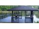 Peaceful covered dock on the lake, perfect for relaxing or enjoying water activities at 45 Surrey Chase Dr, Social Circle, GA 30025