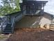 View of a rear deck and a staircase leading to the private area at 45 Surrey Chase Dr, Social Circle, GA 30025