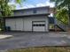 Spacious garage with a convenient drive way and adjacent stairs to an upper level deck at 45 Surrey Chase Dr, Social Circle, GA 30025