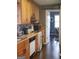 Cozy kitchen featuring wooden cabinets, practical appliances, and decorative tile backsplash at 45 Surrey Chase Dr, Social Circle, GA 30025