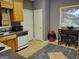 Classic eat-in kitchen featuring wood cabinets, stainless-steel appliances, and tiled flooring at 45 Surrey Chase Dr, Social Circle, GA 30025