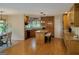 Bright kitchen features an island with bar seating, granite countertops, and wooden cabinetry at 45 Surrey Chase Dr, Social Circle, GA 30025