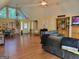 Spacious open-concept living area with ample natural light, wood floors, and easy access to the front door at 45 Surrey Chase Dr, Social Circle, GA 30025