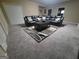 Spacious basement living area with a large sectional sofa, plush carpet and neutral wall color at 45 Surrey Chase Dr, Social Circle, GA 30025