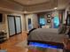 Comfortable main bedroom featuring soft lighting, a tray ceiling, and private outdoor access at 45 Surrey Chase Dr, Social Circle, GA 30025