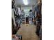 Spacious walk-in closet with ample storage, shelving, and carpet at 45 Surrey Chase Dr, Social Circle, GA 30025