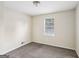 Cozy bedroom with neutral walls and soft carpeting at 1517 Indian Forest Trl, Stone Mountain, GA 30083