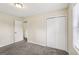 Bedroom with a closet, plush carpet, and natural light at 1517 Indian Forest Trl, Stone Mountain, GA 30083