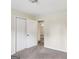 Bedroom with plush carpet, neutral tones, and closet space at 1517 Indian Forest Trl, Stone Mountain, GA 30083
