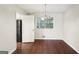 Dining room with elegant chandelier lighting and hardwood flooring at 1517 Indian Forest Trl, Stone Mountain, GA 30083