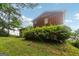 Side view of house with yard and tidy bushes at 1517 Indian Forest Trl, Stone Mountain, GA 30083