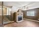 Spacious living room featuring a brick fireplace and wood-look flooring at 1517 Indian Forest Trl, Stone Mountain, GA 30083