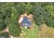 Aerial view of the home showcasing its roof, surrounding greenery, and landscaping at 949 Amelia Rd, Locust Grove, GA 30248