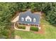 Birds-eye view of the house showing a well maintained lawn and landscaping that enhances curb appeal at 949 Amelia Rd, Locust Grove, GA 30248
