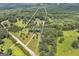Stunning aerial view of 15.91 acre property featuring a long driveway and lush greenery at 949 Amelia Rd, Locust Grove, GA 30248