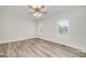 Bedroom with a ceiling fan, wood floor and natural light at 949 Amelia Rd, Locust Grove, GA 30248