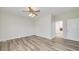 Spacious bedroom with ceiling fan and hardwood floors at 949 Amelia Rd, Locust Grove, GA 30248
