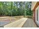 Newly constructed wooden deck overlooking the backyard, perfect for outdoor dining and relaxation at 949 Amelia Rd, Locust Grove, GA 30248