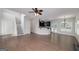 Open-concept living area with hardwood flooring, flowing into the kitchen and dining spaces at 949 Amelia Rd, Locust Grove, GA 30248
